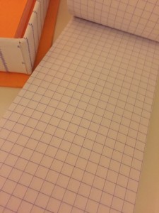 Squared paper is included.